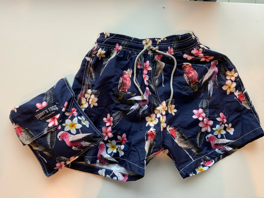 Galah, frangipani, blue shorts